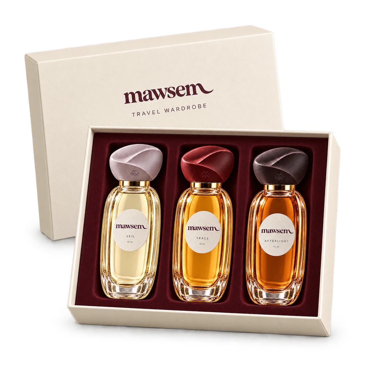 MAWSEM Travel Wardrobe: VEIL, TRACE and AFTERLIGHT, three 10 ml fluted-glass travel sprays in an open ivory box with a wine-colored fitted interior